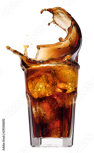 Cola splashing out of a glass., Isolated white background.