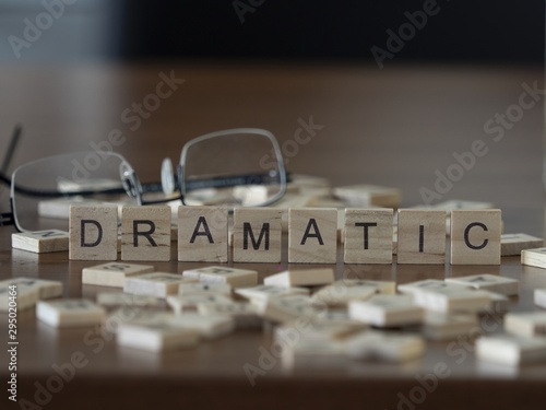 The concept of Dramatic represented by wooden letter tiles photo