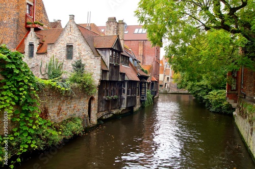 Medieval wooden and brick buildings at canal street in Bruges. Autumn landscape of old historical town in Europe. Autumn travel landscape. architecture in Brugge, Belgium