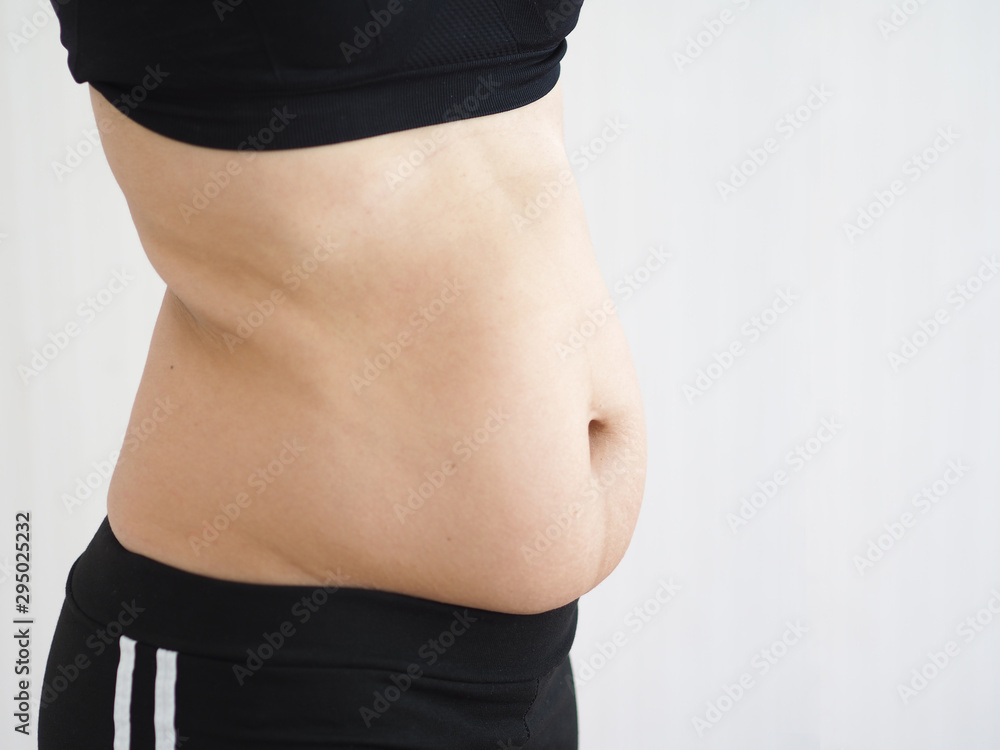 Φωτογραφία cellulite and belly fat in woman on her abdomen and waist cause of fatty from we