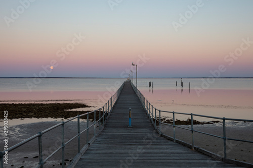 The moon and pier at Ceduna in South Australia at dawn
