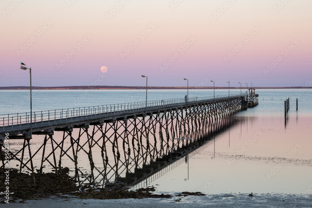 The moon and pier at Ceduna in South Australia at dawn