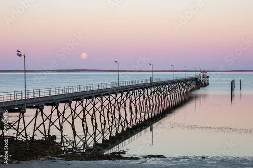 The moon and pier at Ceduna in South Australia at dawn © Michael Evans