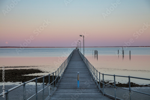 The moon and pier at Ceduna in South Australia at dawn