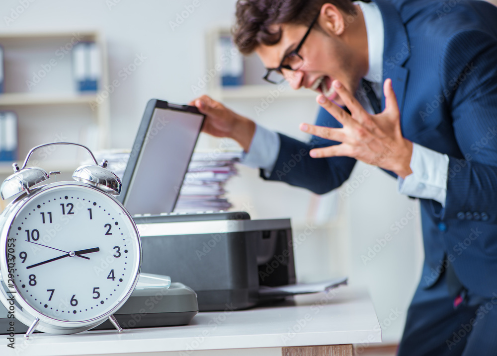 Businessman making copies in copying machine Businessman making copies in copying machine
