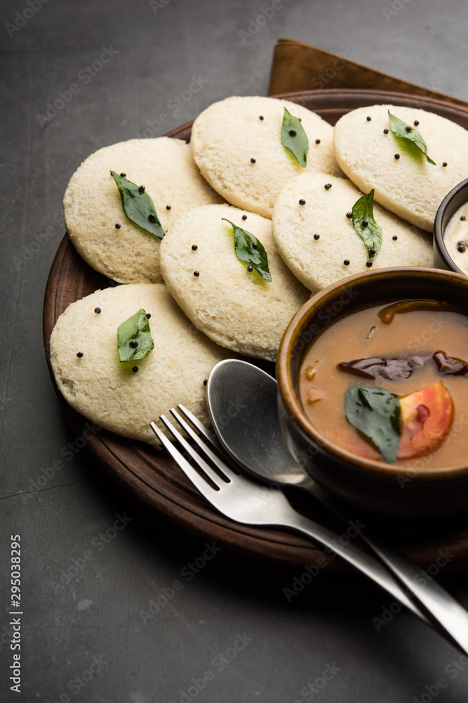 Idli Sambhar or Idly Sambar is a popular south Indian food, served with coconut chutney. selective focus Idli Sambhar or Idly Sambar is a popular south Indian food, served with coconut chutney. selective focus