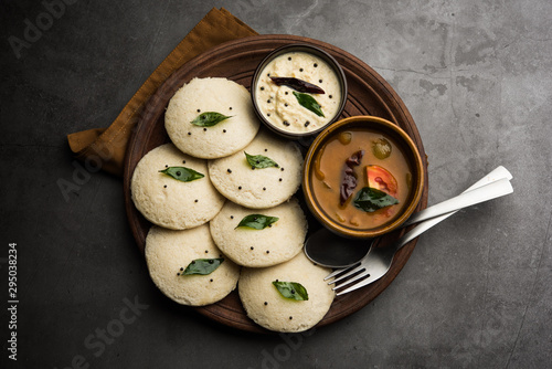 Idli Sambhar or Idly Sambar is a popular south Indian food, served with coconut chutney. selective focus photo