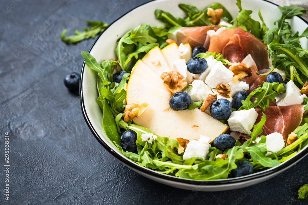 Green salad with leaves, fruit and jamon. Green salad with leaves, fruit and jamon.
