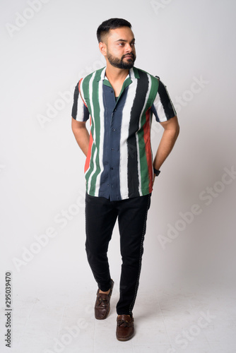 Full body shot of young bearded Indian man thinking © Ranta Images