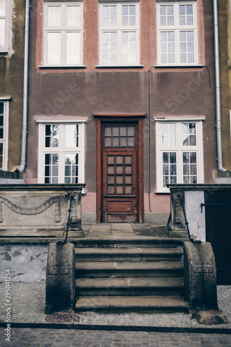 The front of an ornate building in neighborhood of Poland, Gdansk 