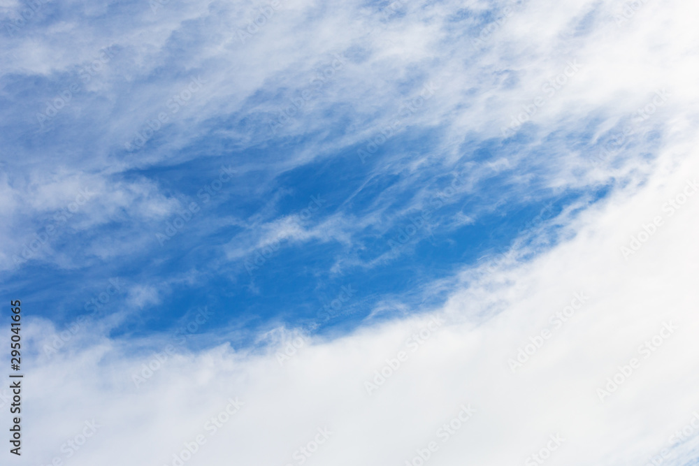 Winter blue sky with white clouds