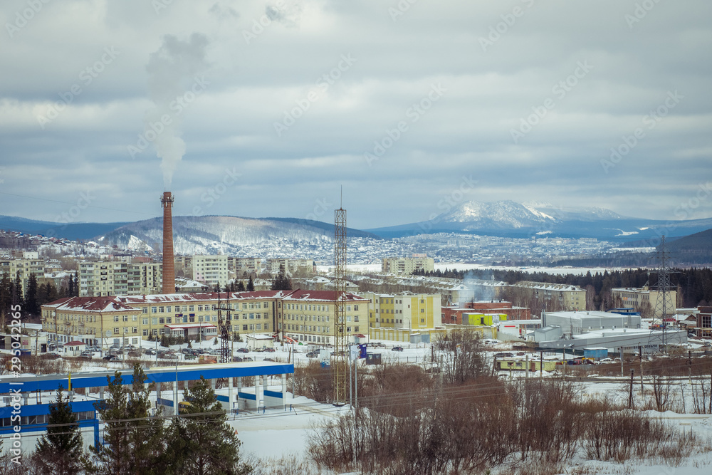 Fototapeta premium Panorama of the city located high in the mountains in the southern Urals. Zlatoust. Russia. winter cityscape