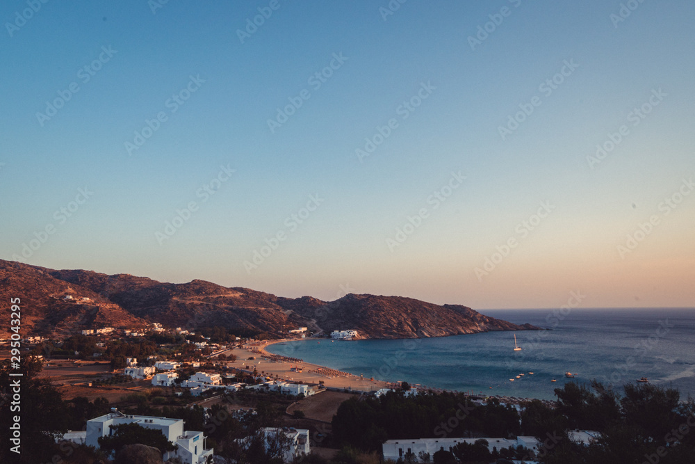 The beautiful island town of Ios, Greece at sunset. Arid and dry landscape with amazing beaches at sunset. 