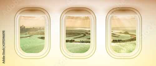 Canvas Print Airplane interior with window view of Dubai Pam Jumeirah Island, UAE