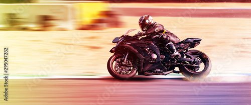 Fotografie motorcycle racer rides on a sports track