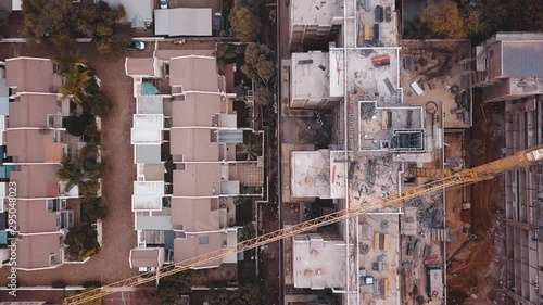 Close up of construction site of apartment building next to terraced houses, Pretoria, South Africa