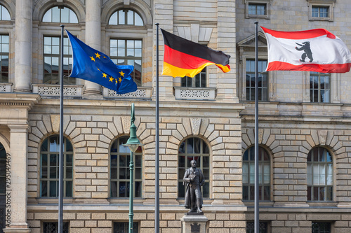 Photography 3 flags (Europe, Germany, Berlin) infront of Abgeordnetenhaus of Berlin, the sta
