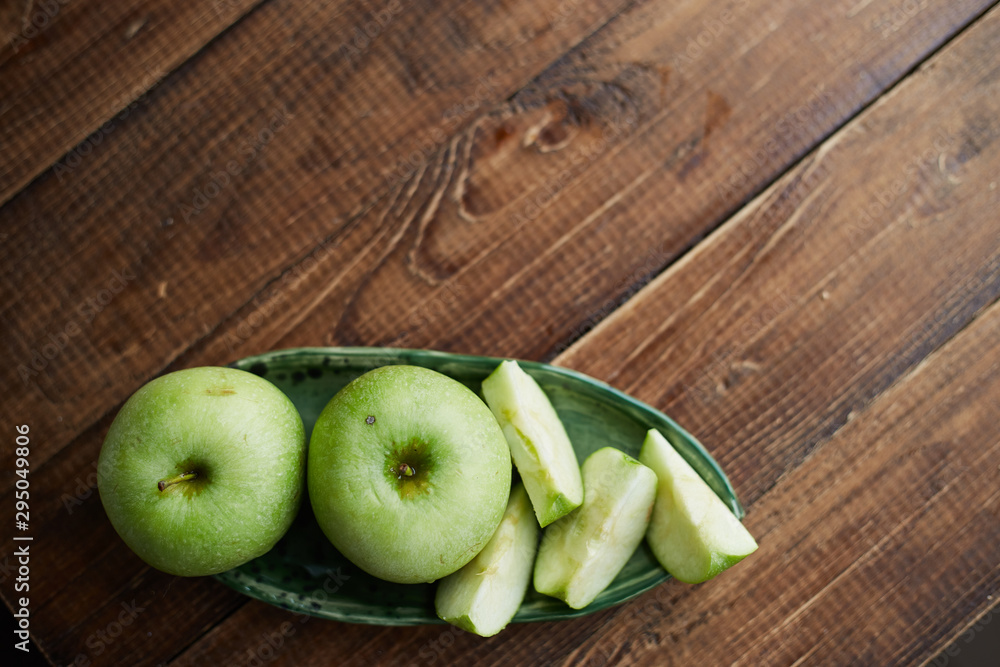 green apples on wooden background green apples on wooden background