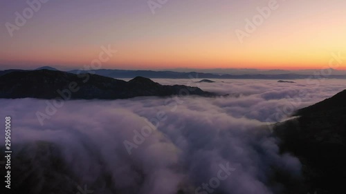 Wallpaper Mural Aerial view of beautiful white cumulus clouds floating over the peaks Torontodigital.ca