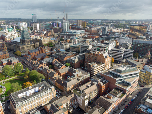 Aerial photo taken on the centre of Leeds in the UK  showing the typical British town centre along with hotels  businesses and shopping centres  taken on a bright sunny part cloudy day