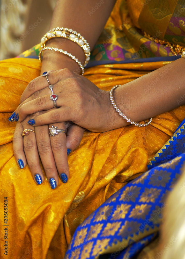 Closeup of Indian bride folded hands