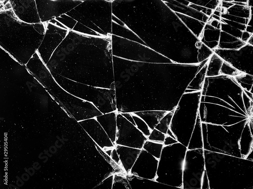 Cracks on glass, screen of broken mobile phone. Cracks on the glass in the form of a web. The phone needs repair_