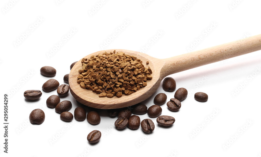 Instant coffee granules and beans with wooden spoon, isolated on white background Instant coffee granules and beans with wooden spoon, isolated on white background