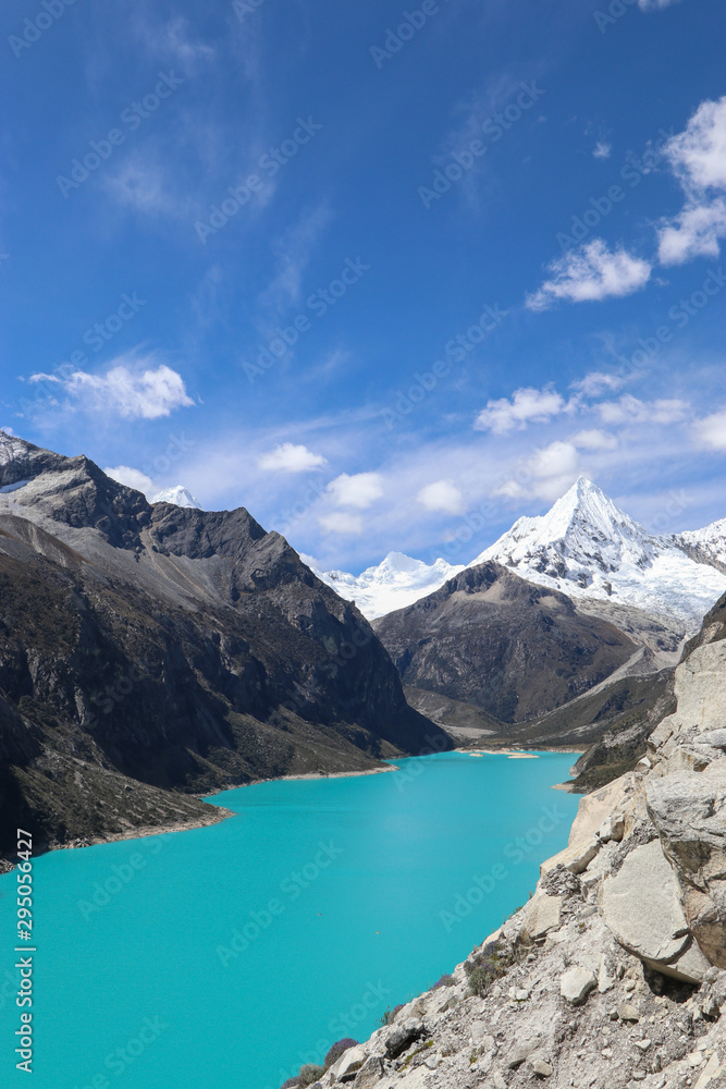 Peru - Hiking around Huaraz to laguna 69 and lake paron in the andes - turquoise blue lakes with snow capped mountains surrounding creating stunning scenery Peru - Hiking around Huaraz to laguna 69 and lake paron in the andes - turquoise blue lakes with snow capped mountains surrounding creating stunning scenery