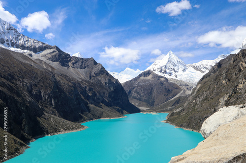 Peru - Hiking around Huaraz to laguna 69 and lake paron in the andes - turquoise blue lakes with snow capped mountains surrounding creating stunning scenery