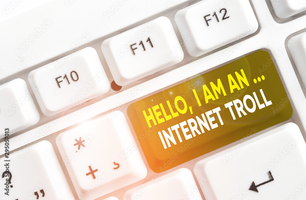 Writing note showing Hello I Am An Internet Troll. Business concept for Social media troubles discussions arguments White pc keyboard with note paper above the white background Writing note showing Hello I Am An Internet Troll. Business concept for Social media troubles discussions arguments White pc keyboard with note paper above the white background