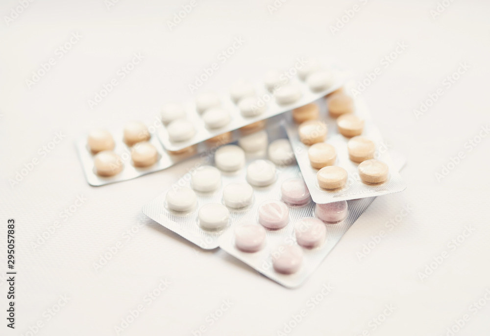 antibiotic pills and vitamins on a white background antibiotic pills and vitamins on a white background