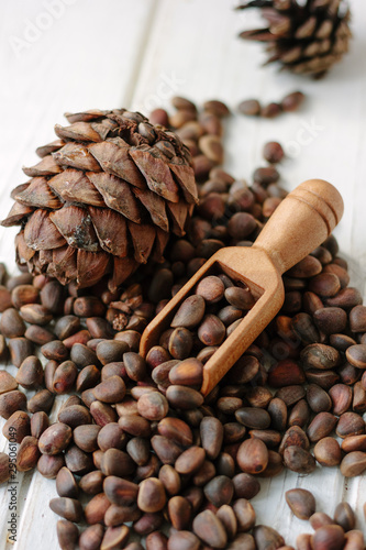 Pine nuts in wooden spoon o...