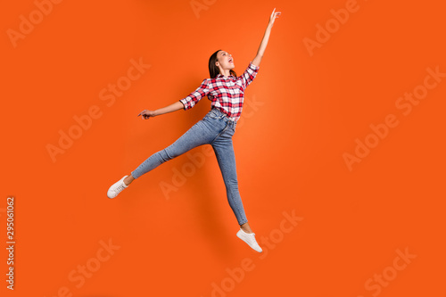 Full size length body photo of attractive charming pretty beautiful charming gorgeous woman jumping up pointing on highest top isolated vibrant color background
