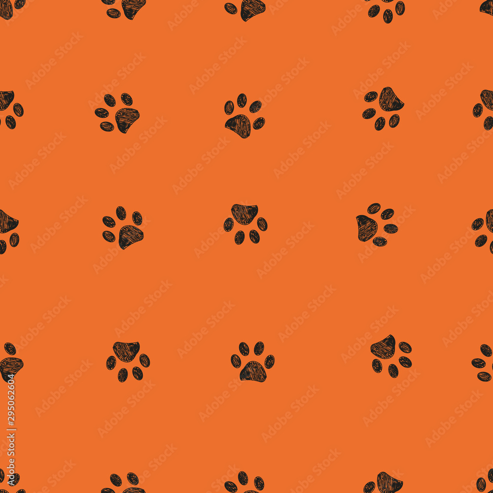 Fototapeta premium Black doodle paw prints with orange background seamless pattern. Happy Halloween background