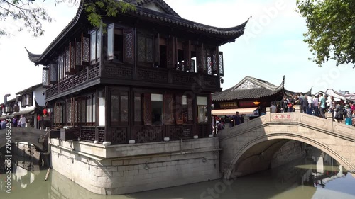  Shanghai Nanxiang Old Town Canal City Taiping Peace Bridge with Walking People on a Sunny Blue Sky Day photo