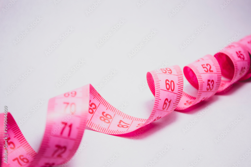 Pink Measuring Tape Isolated On White Background Stock Photo, Picture and  Royalty Free Image. Image 61847596.