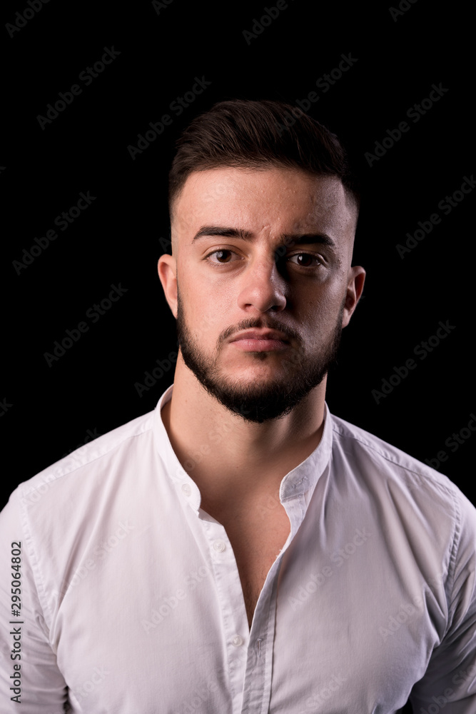 Closeup portrait of a handsome man. Bearded, strong eye contact. Closeup portrait of a handsome man. Bearded, strong eye contact.