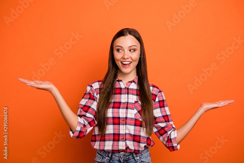 lose up photo portrait of pretty attractive charming intriguing lady showing balance with hands choosing one product isolated bright color background copyspace