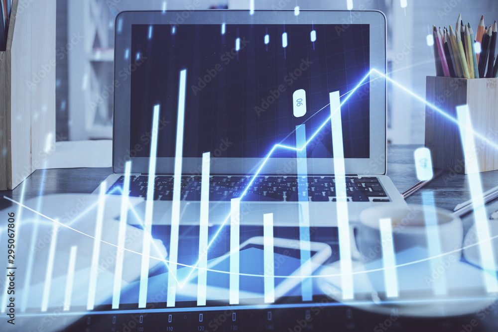 Stock market graph on background with desk and personal computer. Double exposure. Concept of financial analysis. Stock market graph on background with desk and personal computer. Double exposure. Concept of financial analysis.