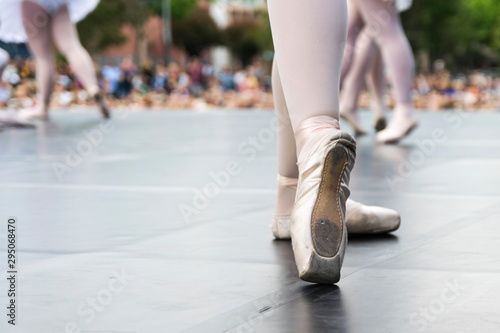 Dancers in a street show, detail of dance shoes - image