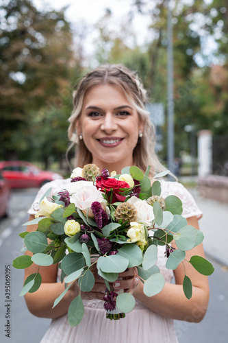 Colourful bouquet and bride