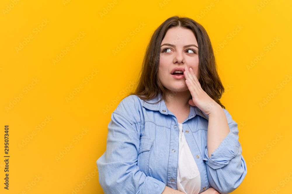 Young curvy plus size woman is saying a secret hot braking news and looking aside Young curvy plus size woman is saying a secret hot braking news and looking aside