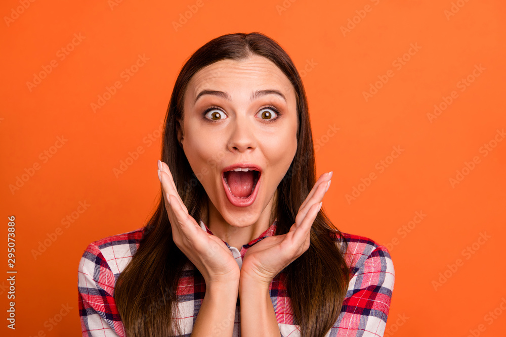 Close-up portrait of her she nice attractive lovely overjoyed cheerful cheery straight-haired girl wearing checked shirt black Friday isolated on bright vivid shine vibrant orange color background Close-up portrait of her she nice attractive lovely overjoyed cheerful cheery straight-haired girl wearing checked shirt black Friday isolated on bright vivid shine vibrant orange color background