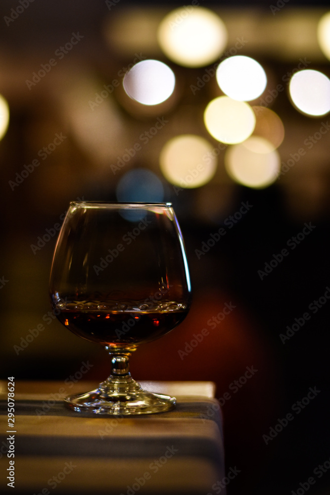Whiskey in glass for adult on counter bar at to night. Whiskey in glass for adult on counter bar at to night.