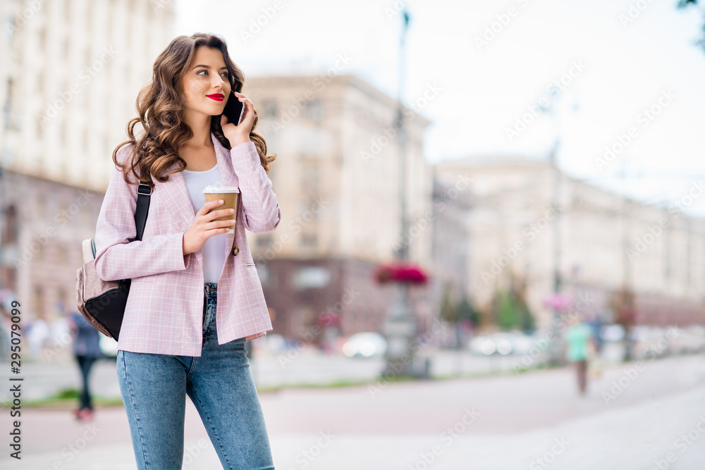 Portrait of her she nice-looking attractive lovely cheerful wavy-haired lady foreign tourist receiving calls from home discussing adventure landmark sightseeing in downtown center outdoors