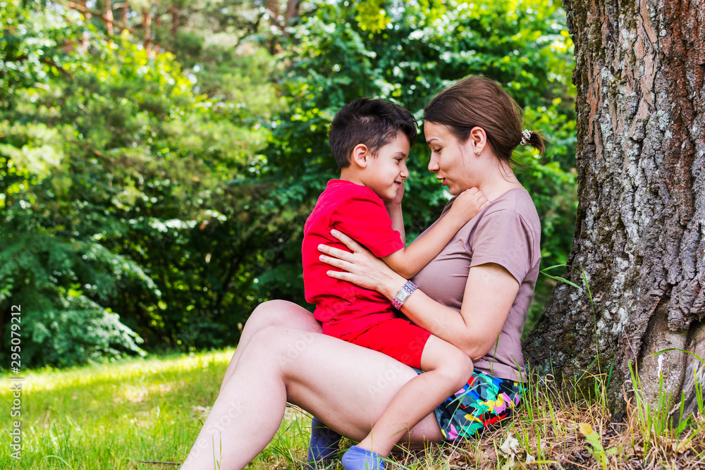 Fototapeta premium mother and son having fun in nature