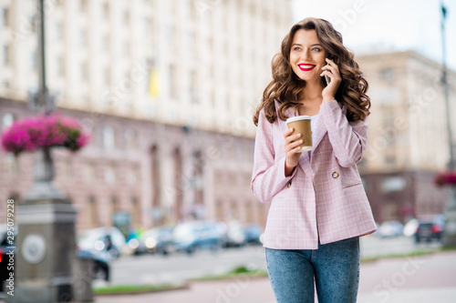 Portrait of her she nice-looking attractive charming lovely cheerful wavy-haired lady foreign tourist calling home adventure discussing in downtown center outdoors