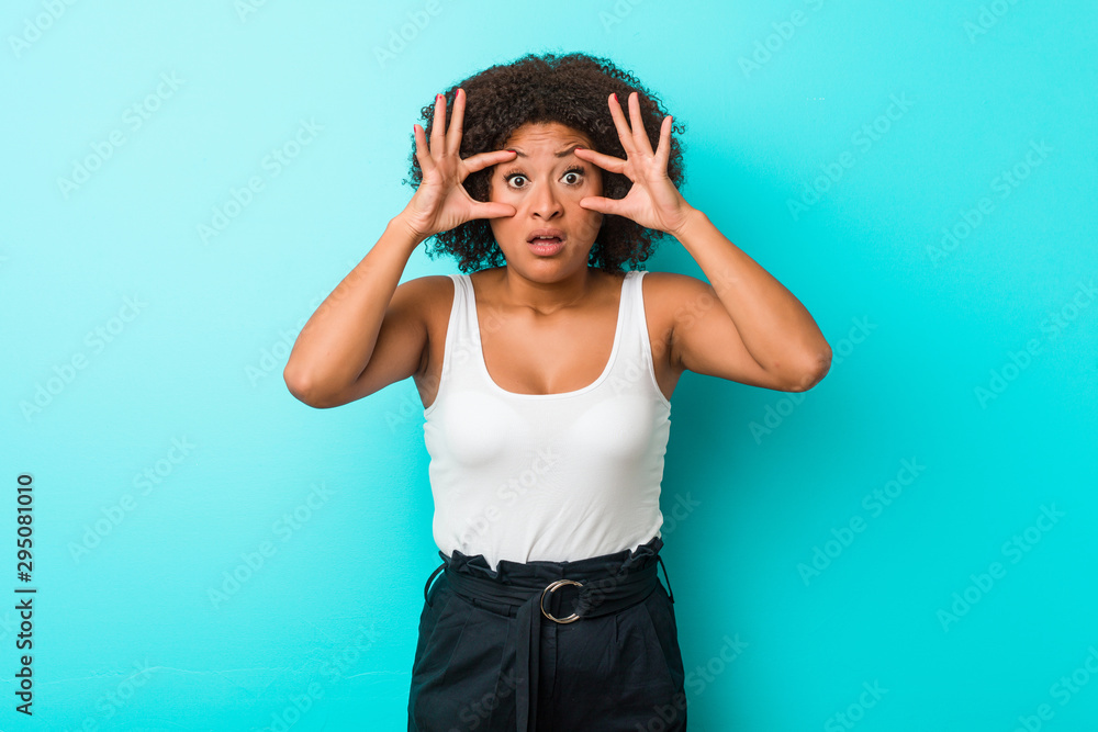 Young african american woman keeping eyes opened to find a success opportunity. Young african american woman keeping eyes opened to find a success opportunity.