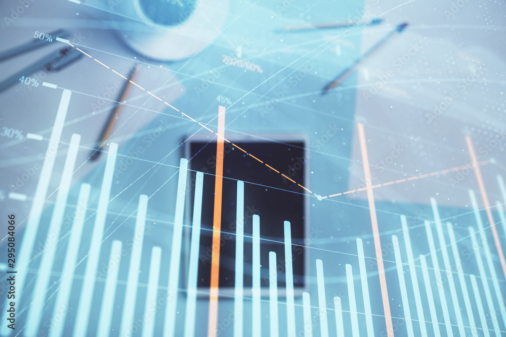 Double exposure of forex graph on digital tablet laying on table background. Concept of market analysis Double exposure of forex graph on digital tablet laying on table background. Concept of market analysis