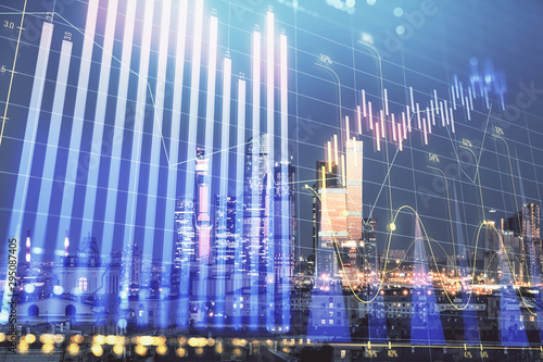 Double exposure of financial chart on Moscow city downtown background. Concept of stock market analysis